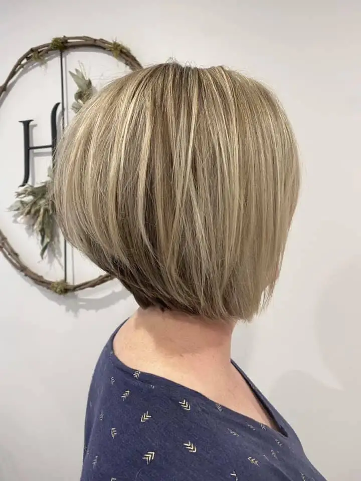 Side view of angled blonde bob with soft highlights
