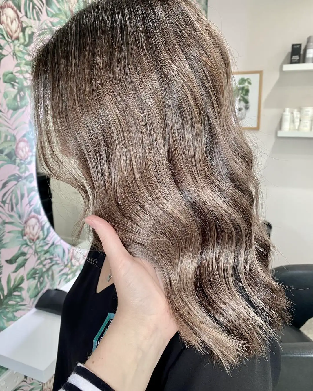 Side view of mid-length mushroom blonde hair with cool waves